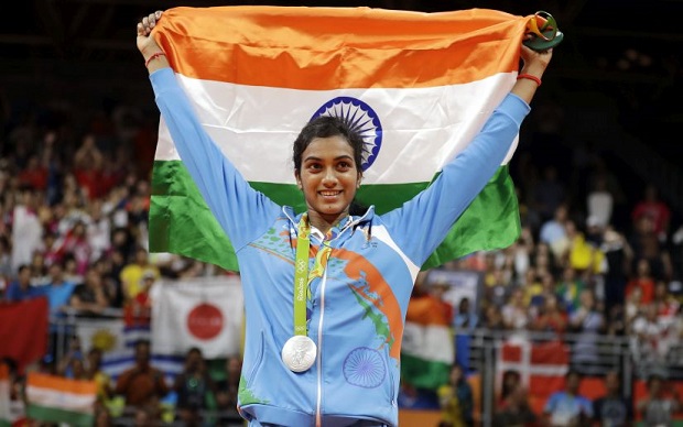India's V. Sindhu Pusarla wears her silver medal during the medal ceremony for women's badminton singles at the 2016 Summer Olympics in Rio de Janeiro, Brazil, Friday, Aug. 19, 2016. (AP Photo/Kin Cheung)