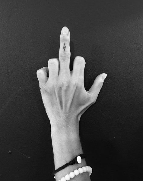 Tiny Harry Potter tattoo on the pinky finger.